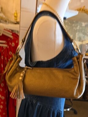 Hobo International Women's Shoulder Bag in Gold with Tassel